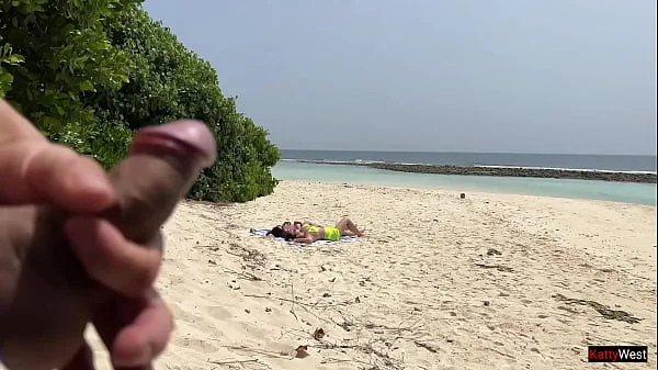 Pervert cummed on girls while they were sunbathing on a public beach