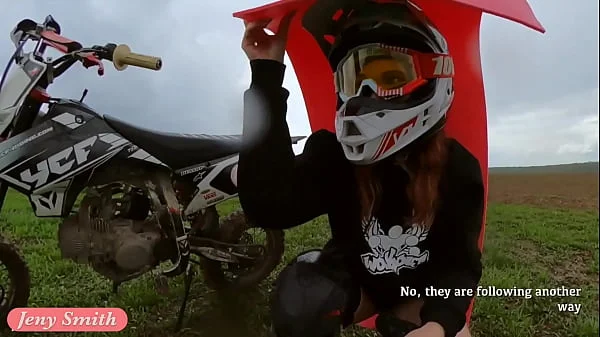 Naked woman riding a Dirt Bike