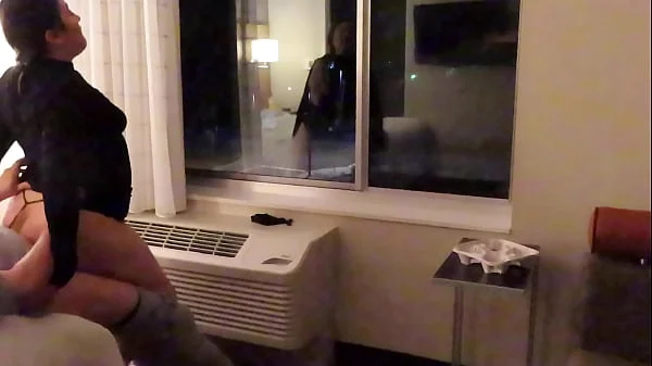 Having fun wearing a see through short dress in hotel public areas