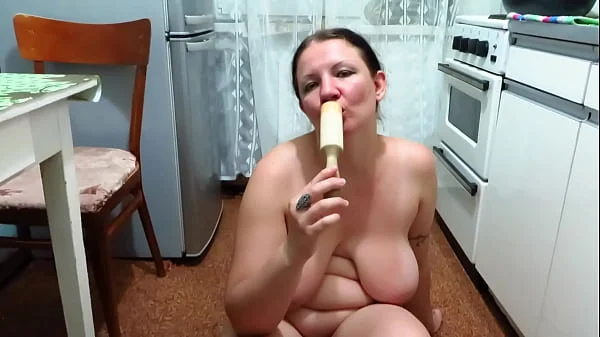 Chubby milf cooks pies and fucks with a wooden pestle in the kitchen. Her juicy PAWG and big tits are shaking. Homemade fetish. Does your wife make dinner naked?