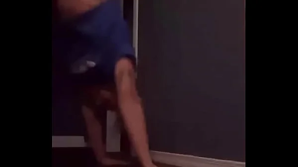 Teen doing a handstand with nip slip