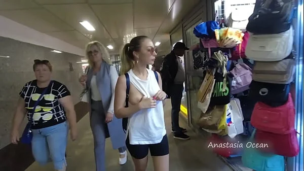 A girl rides a public bus with bare breasts